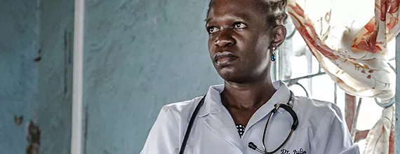 A female doctor looking in the distance A female doctor looking in the distance