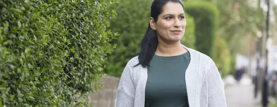 A woman goes for a walk Kidney disease patient walks to her appointment with her