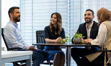 colleagues in office at table