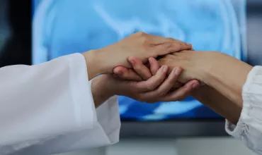 Doctor holding patients hand Doctor holding patients hand