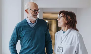 Doctor and patient talking in hallway Doctor and patient talking in hallway