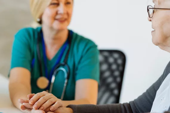 Doctor with a patient in office Doctor with a patient in office