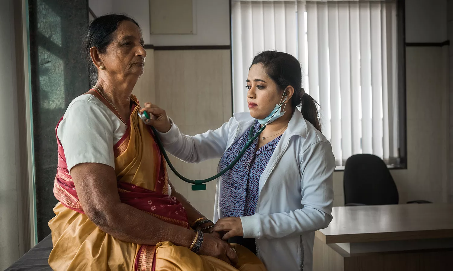 Elderly woman visits the doctor's clinic for a medical check-up Elderly woman visits the doctor's clinic for a medical check-up