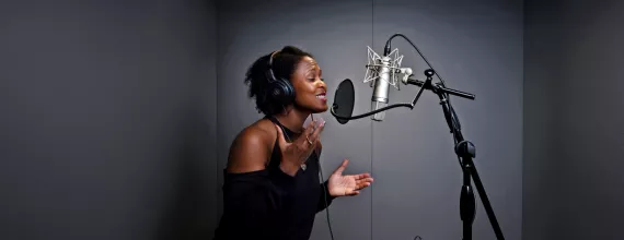 Shanelle Gabriel rehearses a poem in a studio. Shanelle Gabriel rehearses a poem in a studio.